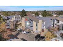 Beautiful condominium with stone accents, gray siding, and well-maintained landscaping at 9797 E Peakview Ave # C10, Englewood, CO 80111