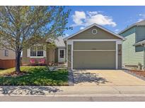 Charming single-story home with a well-maintained lawn and a two-car garage at 3787 Bucknell Dr, Highlands Ranch, CO 80129