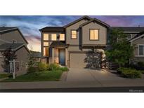 Charming two-story home boasts meticulous landscaping, inviting curb appeal and an attached two-car garage at 2668 Scoter Ln, Castle Rock, CO 80104