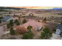 Expansive home on acreage featuring mature trees and large private lots at 265 Ox Yoke Way, Monument, CO 80132