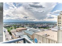 Expansive city view featuring skyline and distant mountains from a high-rise building at 891 14Th St # 2002, Denver, CO 80202