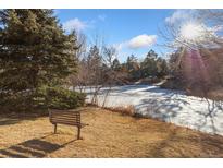 Peaceful pond view with a bench, perfect for relaxing at 1150 Golden Cir # 201, Golden, CO 80401