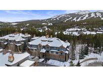 Beautiful condo with mountain views and snow-covered roof at 43 Snowflake Dr # D7, Breckenridge, CO 80424