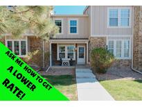 Charming townhome with stone accents and a cozy front porch perfect for relaxing at 9671 W Chatfield Ave # B, Littleton, CO 80128