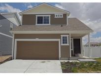 Two-story home with attached garage and landscaped front yard at 5550 Malta St, Denver, CO 80249