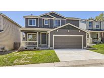Charming two-story home featuring a covered porch and a two-car garage at 1138 W 84Th Pl, Denver, CO 80260