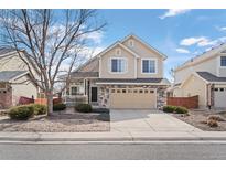 Charming two-story home with neutral siding, stone accents, and a well-maintained front yard at 15028 Clayton St, Thornton, CO 80602