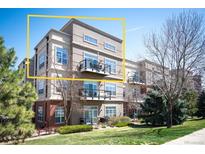 Modern condo building featuring private balconies, manicured lawn and beautiful landscaping at 5677 S Park Pl # B310, Englewood, CO 80111