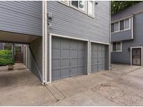 Attached two-car garage features paneled doors and neutral trim at 101 S Downing St # 8, Denver, CO 80209