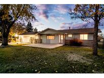 Charming single-story home with well-maintained lawn and beautiful, mature trees offering curb appeal at 8895 Morton Rd, Niwot, CO 80503
