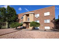 Brick building exterior with landscaping and walkway at 1620 Colorado Blvd # 6, Denver, CO 80220