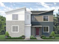 Striking two-story modern home with eye-catching split color scheme and low maintenance front yard at 1458 Coral Pl, Longmont, CO 80504