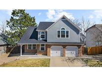 Charming two-story home featuring a two-car garage and well-maintained landscaping at 13588 Jackson St, Thornton, CO 80241