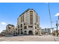 Elegant condo building with Beaux-Arts architecture, balconies and street-level retail space at 975 N Lincoln St # 3E, Denver, CO 80203