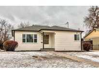 Charming single-story home with a well-maintained front yard and sidewalk at 808 Hanover St, Aurora, CO 80010