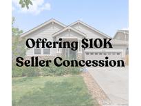 Charming single-Gathering home with manicured lawn and inviting entrance, complemented by a two-car garage at 6484 S Harvest St, Aurora, CO 80016