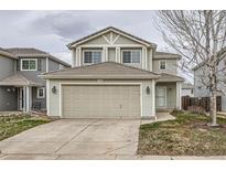 Charming two-story home with a two-car garage and well-maintained lawn at 20785 E 39Th Ave, Denver, CO 80249
