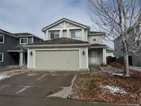 Charming two-story home featuring a neutral color palette and a two-car attached garage at 20785 E 39Th Ave, Denver, CO 80249