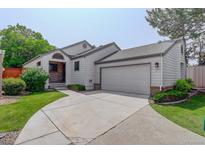 Charming home showcasing a well-maintained yard and inviting curb appeal with a two-car attached garage at 11186 E Baltic Dr, Aurora, CO 80014