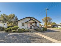 Charming single-story home with a well-maintained lawn and inviting front porch at 101 S 11 Ave, Brighton, CO 80601
