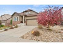 Charming two-story home with a well-manicured front yard and inviting curb appeal at 7790 S Queensburg Way, Aurora, CO 80016