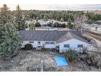 Charming ranch-style home featuring a well-maintained roof and mature trees on a large lot at 754 Highway 86 Hwy, Elizabeth, CO 80107