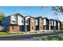 Modern townhome exteriors showcasing brick and siding, complemented by landscaped yards at 9061 E 14Th St, Aurora, CO 80010