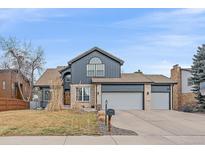 Charming two-story home with a well-manicured lawn and an attached two-car garage at 1769 W 113Th Ave, Denver, CO 80234