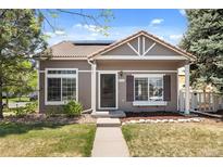 Charming single-Gathering home features a well-maintained lawn, inviting facade, and appealing landscaping at 4713 Perth St, Denver, CO 80249