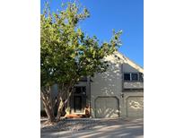 Traditional two-story home with a two-car garage and lush landscaping at 5479 E Weaver Ave, Centennial, CO 80121