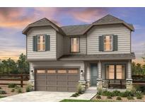 Charming two-story home featuring a two-car garage, stone accents, and a well-maintained front yard at 39713 Penn Rd, Elizabeth, CO 80107