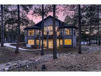 Stunning brick home with a large backyard, two-car garage, and a beautifully landscaped front yard at 6517 Perry Park Blvd, Larkspur, CO 80118