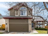 Charming two-story home with a two-car garage, brick accents, and beautiful landscaping at 4165 S Granby Cir, Aurora, CO 80014