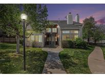 Charming exterior of a two-story townhouse with well-maintained landscaping and inviting entrance at dusk at 13762 E Lehigh Ave # G, Aurora, CO 80014