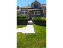 Charming front exterior of a two-story home with stone accents and landscaped front yard at 10129 Grove Ct # B, Westminster, CO 80031