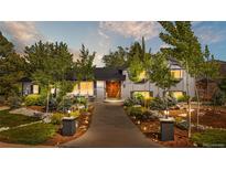 Charming two-story home with beautifully landscaped front yard and inviting entrance at 4218 S Alton St, Greenwood Village, CO 80111