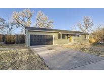 Charming single-story home with an attached garage and a large driveway at 1205 W 101St Ave, Northglenn, CO 80260