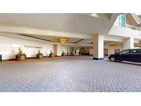 Elegant Ritz-Carlton entrance with brick paving and luxury hotel lobby access at 1891 Curtis St # 1613, Denver, CO 80202
