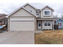Inviting two-story home with neutral siding, brick accents, and a convenient attached two-car garage at 13176 Alcott Pl, Broomfield, CO 80020