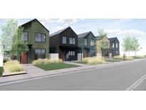 Street-level view of modern townhomes with well-manicured lawns and modern architectural details at 783 E County Line Rd, Erie, CO 80516
