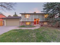 Charming two-story home with red brick and a well-maintained front yard at 12642 E Ohio Ave, Aurora, CO 80012