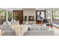 Inviting living room features a cozy fireplace and sophisticated decor at 8955 E 19Th Ave, Aurora, CO 80010