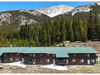 Charming two-story condo with wooden accents, balcony, and scenic mountain views at 4192 Highway 9 # 3, Breckenridge, CO 80424