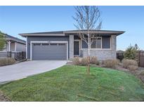 Charming home featuring a manicured front yard and a two-car garage at 26902 E Ellsworth Ave, Aurora, CO 80018