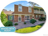 Charming brick townhouse with brand new roof and landscaped front yard, ready for move-in at 7391 S Knolls Way, Centennial, CO 80122