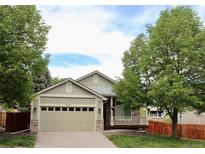 Charming single-Gathering home with a two-car garage and a cozy front porch at 16179 W 70Th Pl, Arvada, CO 80007
