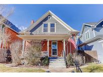 Charming brick home featuring a cozy front porch, well-maintained landscaping, and classic architectural details at 515 S Grant St, Denver, CO 80209