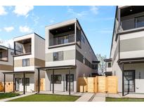 Modern townhomes featuring a sleek design, private balconies, and well-maintained landscaping at 1737 Lowell Blvd, Denver, CO 80204