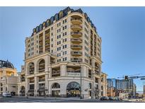 Stunning multi-story building with brick facade, balconies, and unique architectural details at 975 N Lincoln St # 4I, Denver, CO 80203