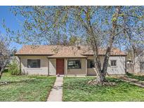 Charming single-story home with a well-maintained lawn and mature tree in a residential neighborhood at 2865 S Fairfax St, Denver, CO 80222